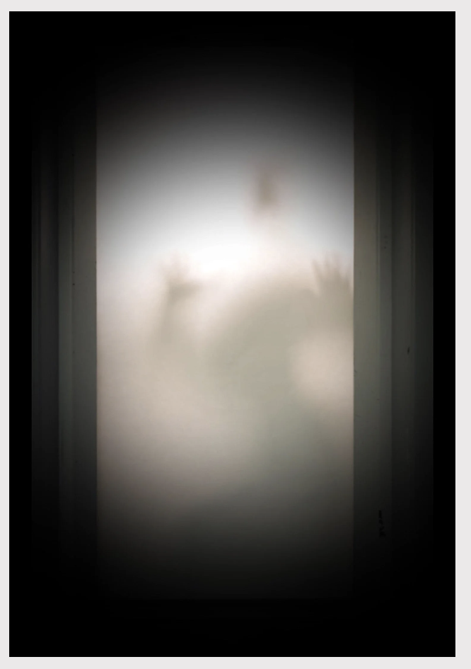 Soft silhouettes appearing behind a luminous white field