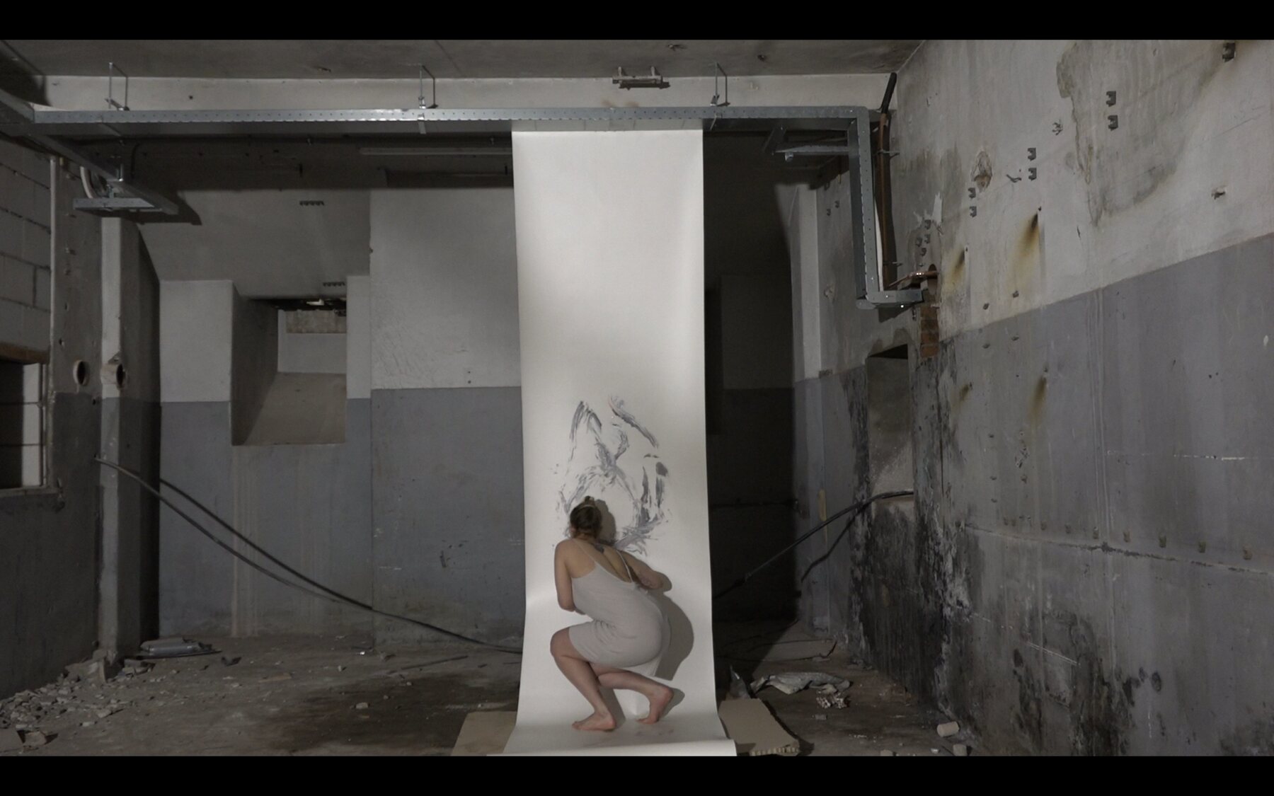 The body crouched beside the accumulating marks